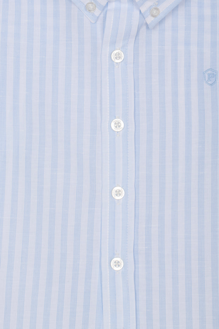 Close-up of a light blue striped shirt with white buttons