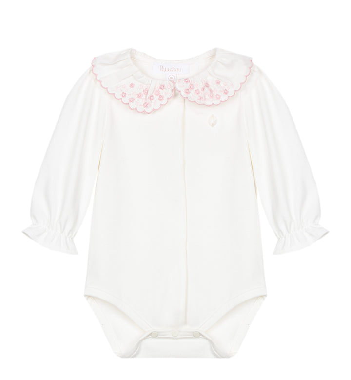 A white long-sleeve baby bodysuit featuring a decorative pink embroidered floral Peter Pan collar, displayed flat against a solid white background.