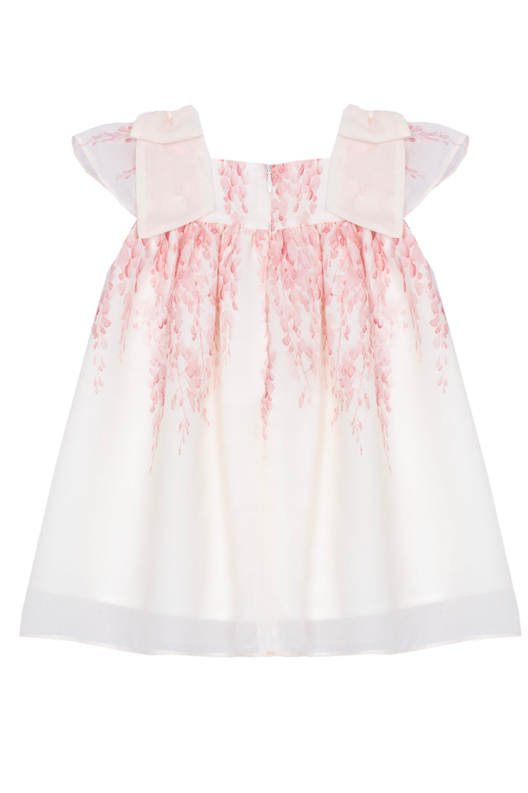 White dress with pink floral pattern on a white background