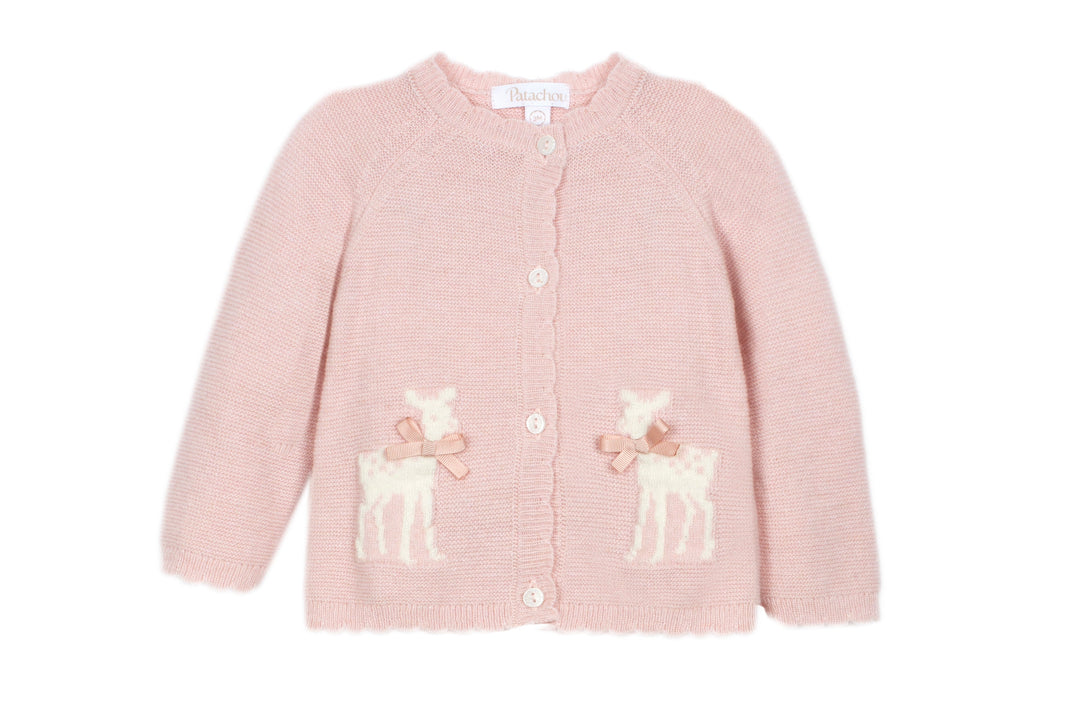 A light pink knit cardigan sweater for a child, featuring two cream-colored embroidered deer motifs with pink bows on the lower front, set against a plain white background.