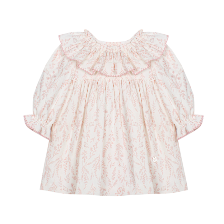A baby girl's short-sleeve dress with a delicate pink botanical pattern on a warm cream background, featuring a large ruffled collar and ruffled cuffs.