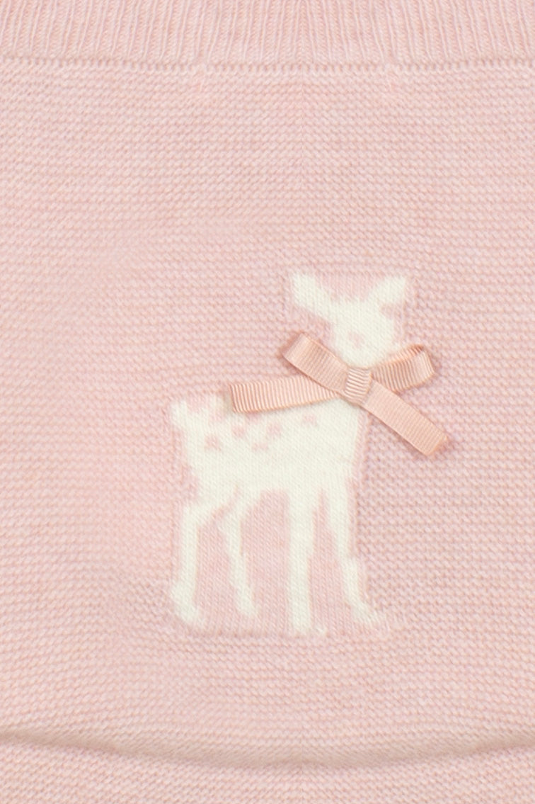 Close-up of a light pink knitted garment featuring a white knitted deer motif with a matching pale pink ribbon bow.