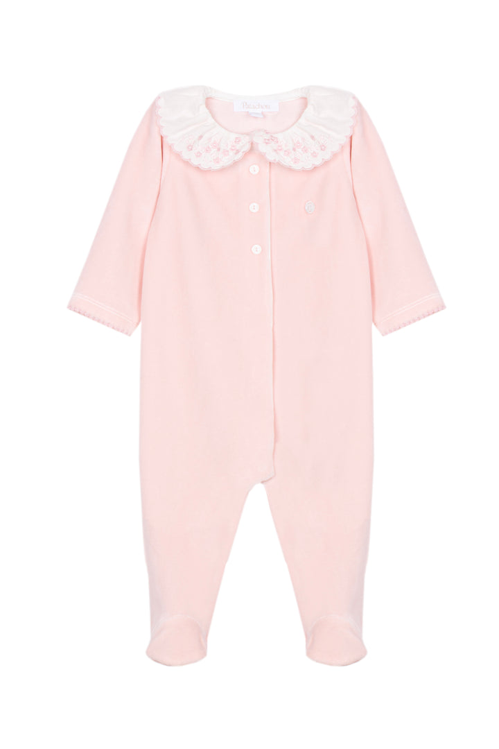 A light pink baby footed one-piece jumpsuit with a white lace Peter Pan collar and white snap buttons down the front, shown on a plain white background.