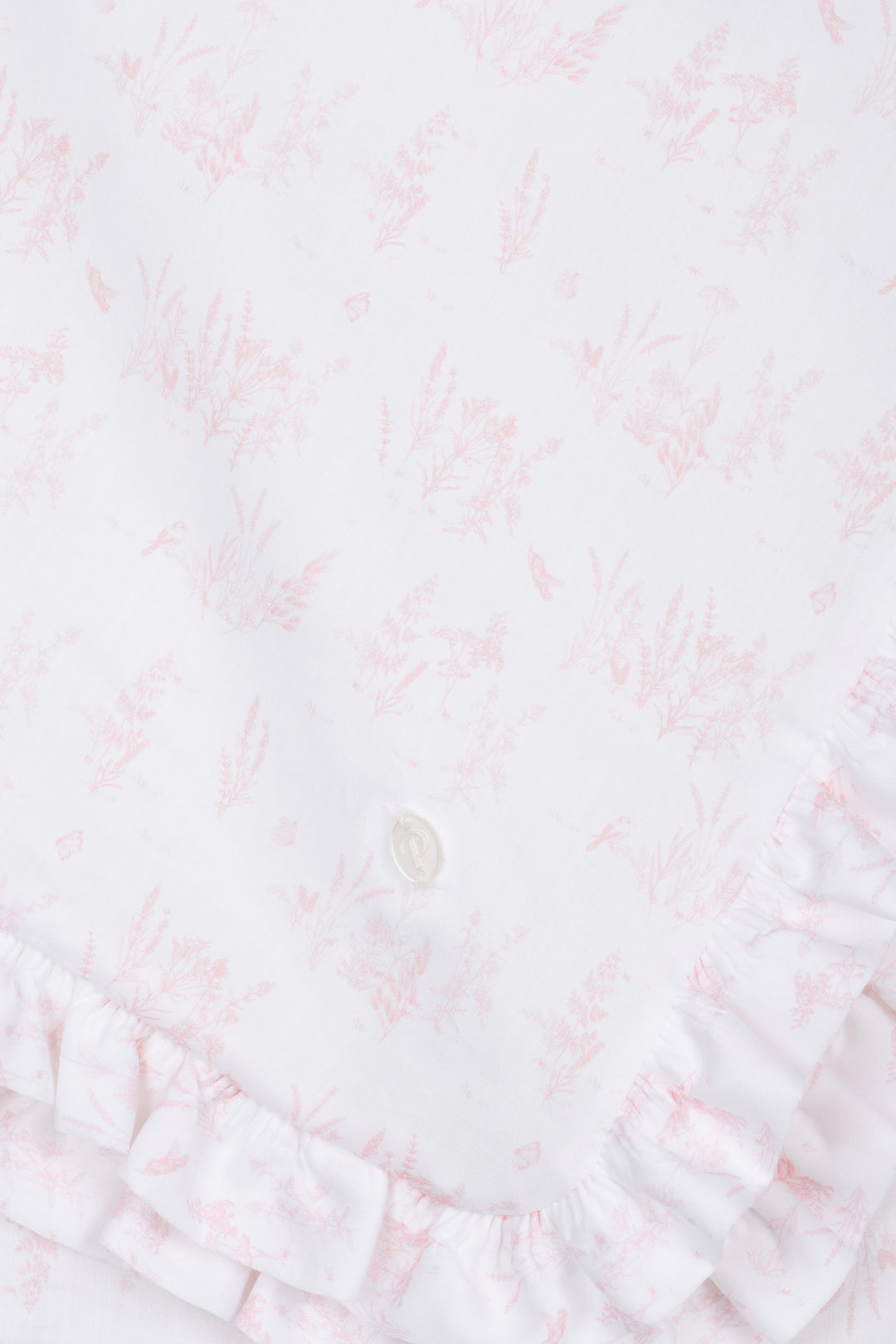 Close-up of a textured white fabric with subtle patterns