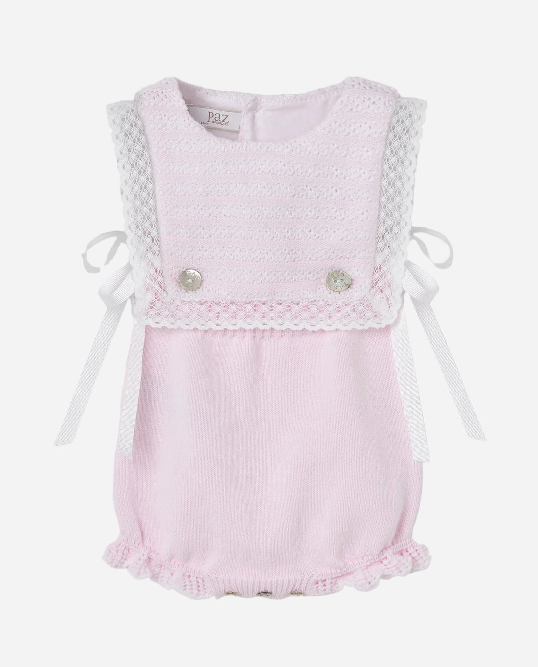 Pink baby romper with lace details on a gray background
