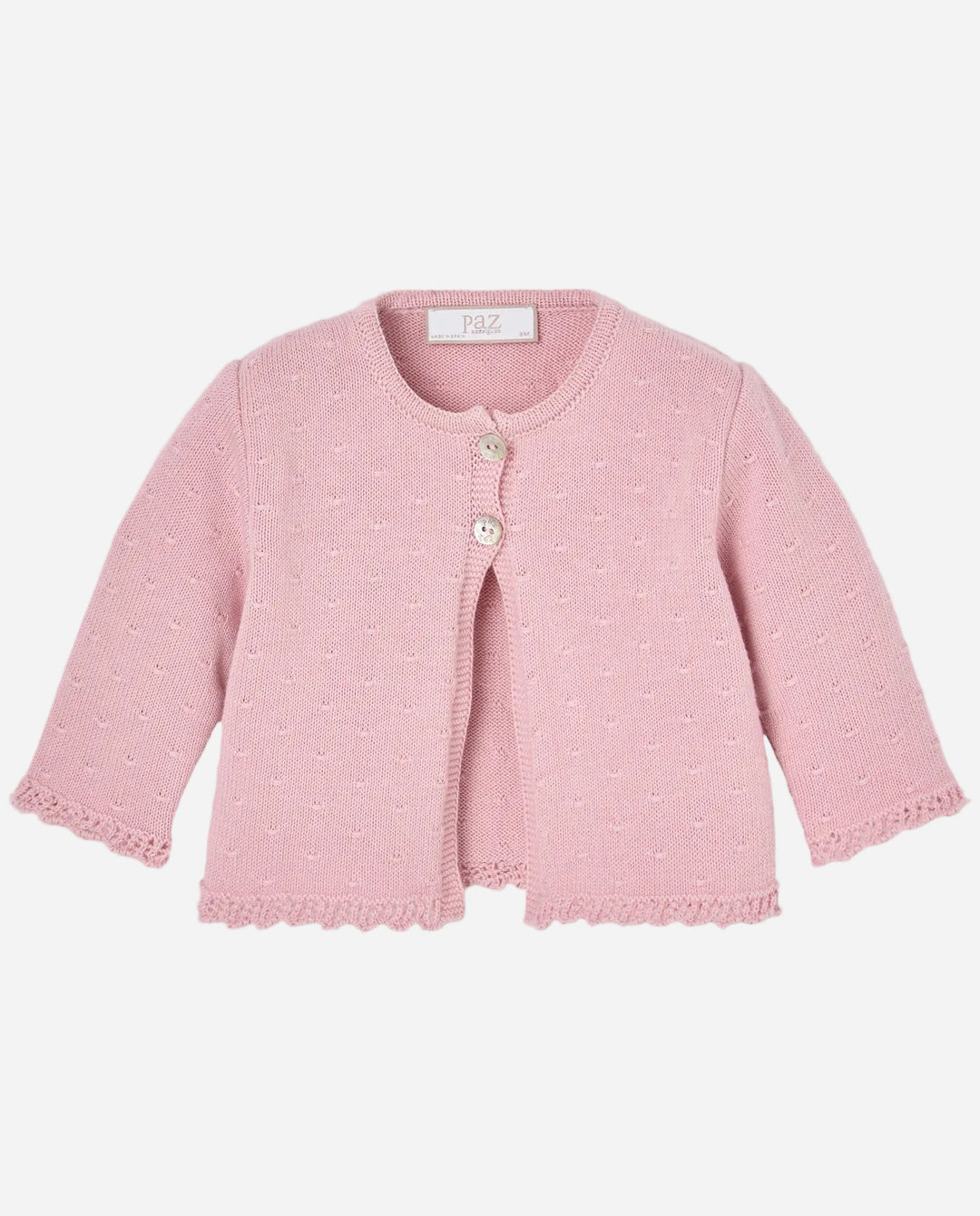 Pink baby cardigan on a light gray background