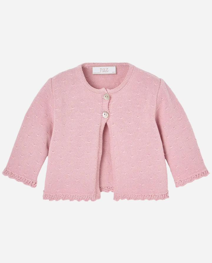 Pink baby cardigan on a light gray background