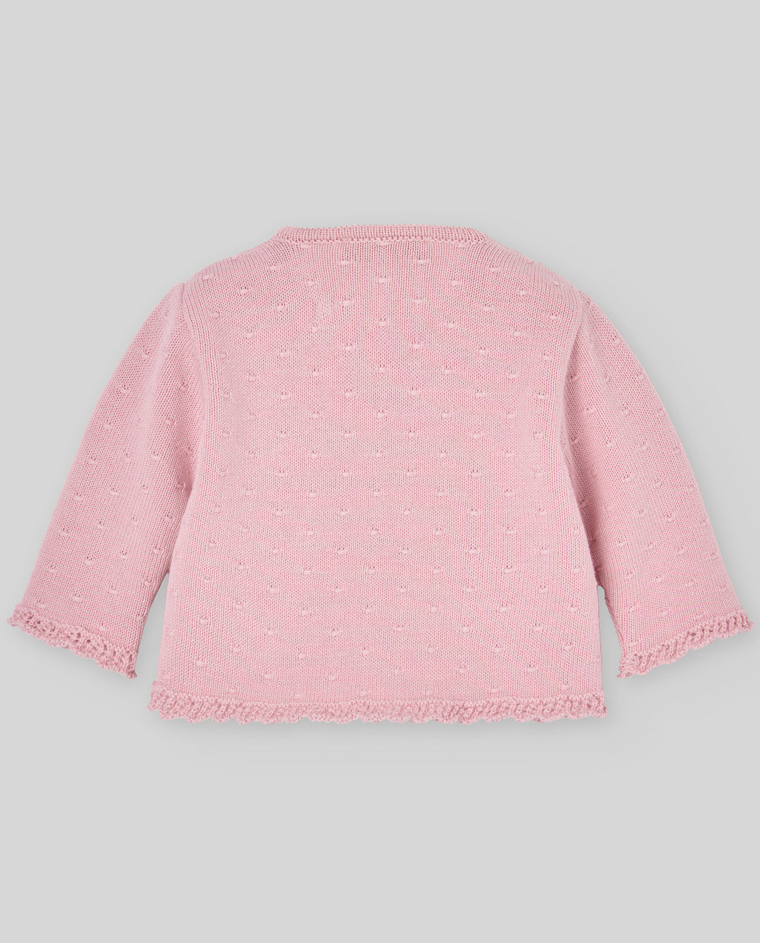 Pink textured cardigan on a light gray background