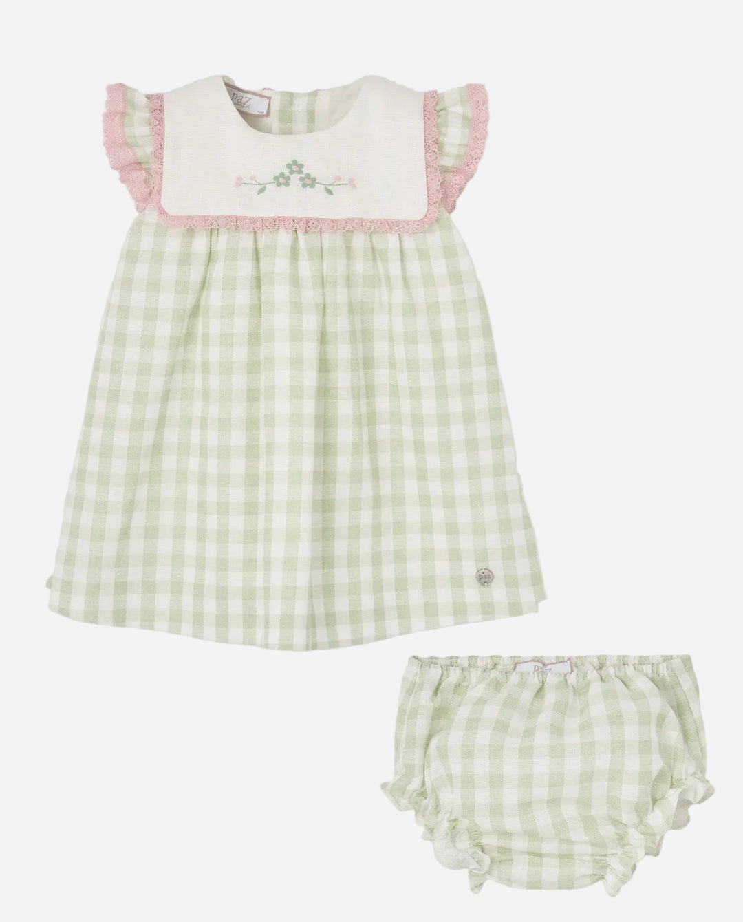 Green checkered baby dress with pink trim and matching bloomers on a light gray background