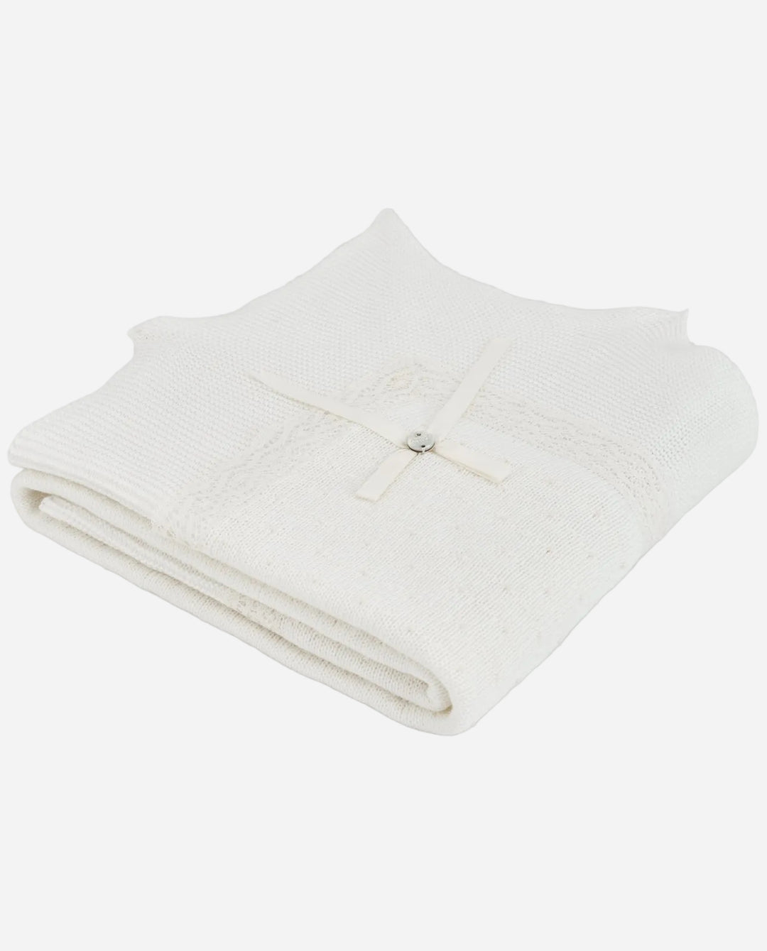 Folded white blanket on a light gray background