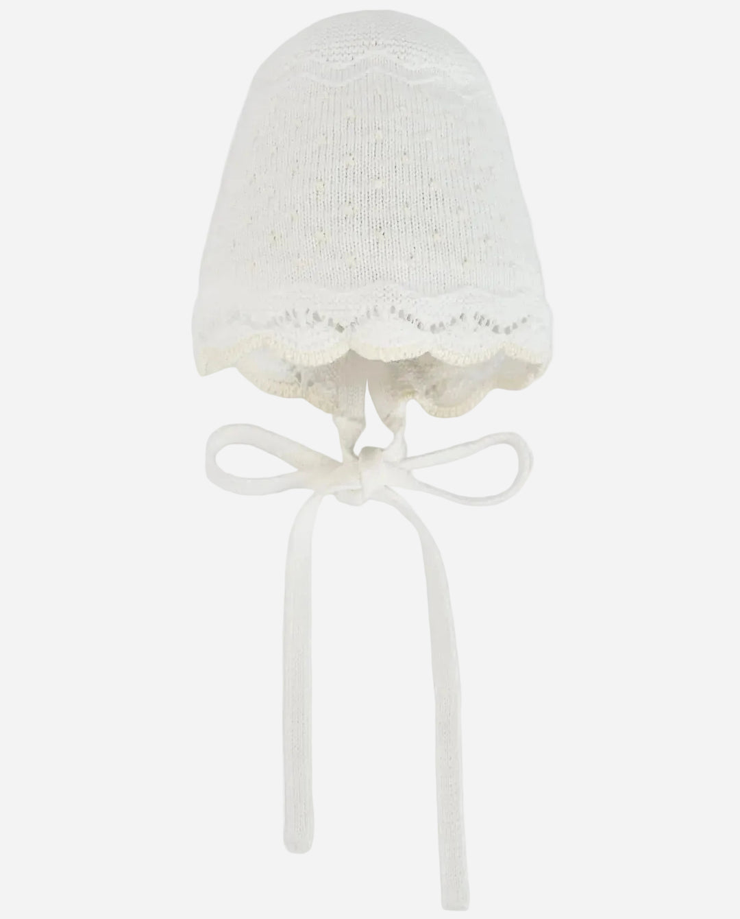 White knitted bonnet with lace trim on a white background