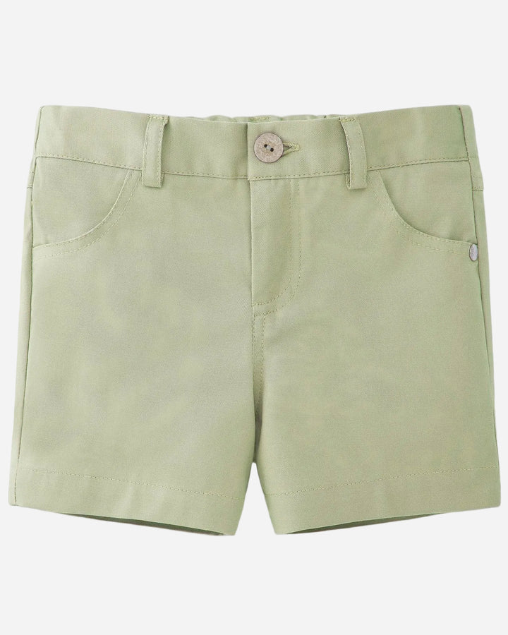 Light green shorts on a light gray background