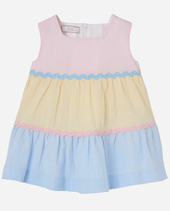 Pastel color-blocked dress with pink, yellow, and blue on a light gray background