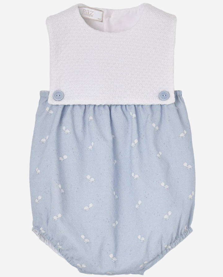 Baby romper with light blue patterned bottom and white top on a gray background