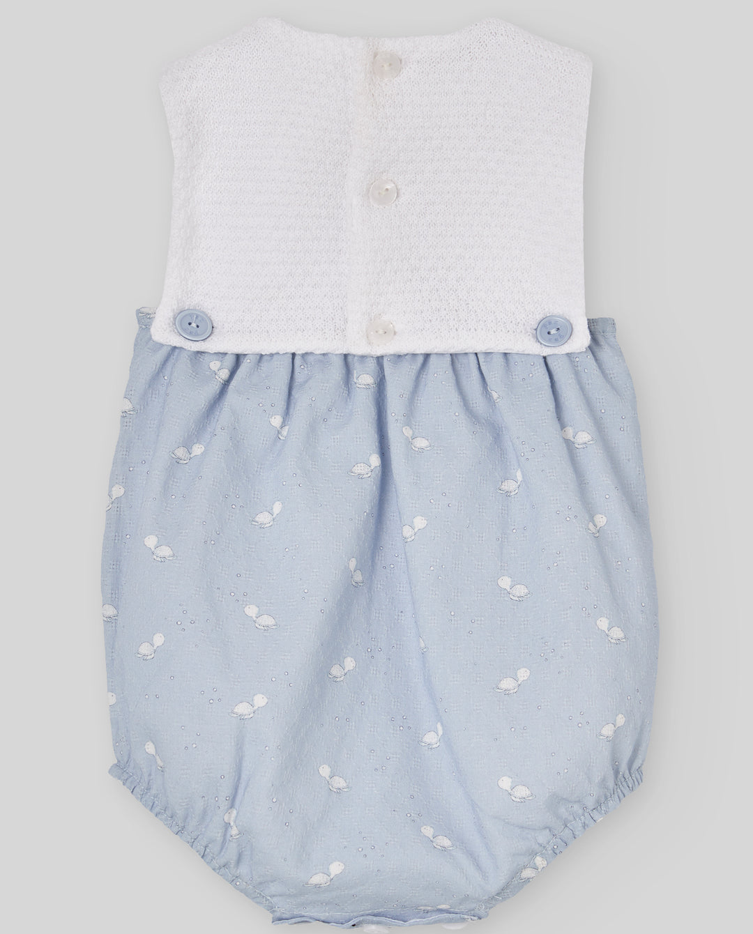 Baby romper with white top and blue bloomers on a light gray background