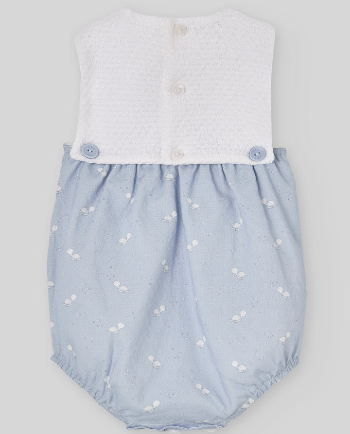 Baby romper with white top and blue bloomers on a light gray background