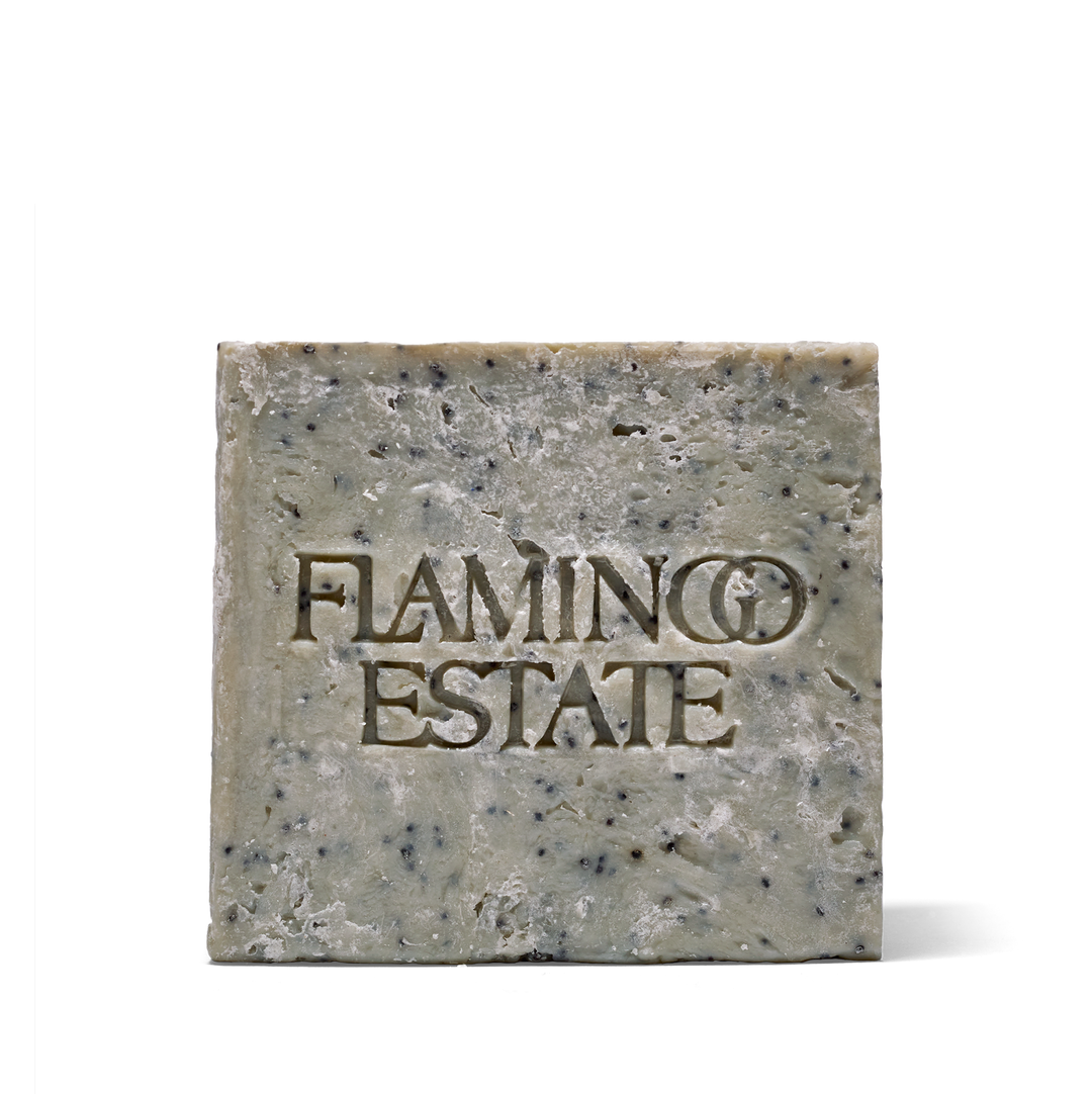 A single rectangular bar of soap with the brand name 'FLAMINGO ESTATE' embossed on the front, shown against a plain white background.