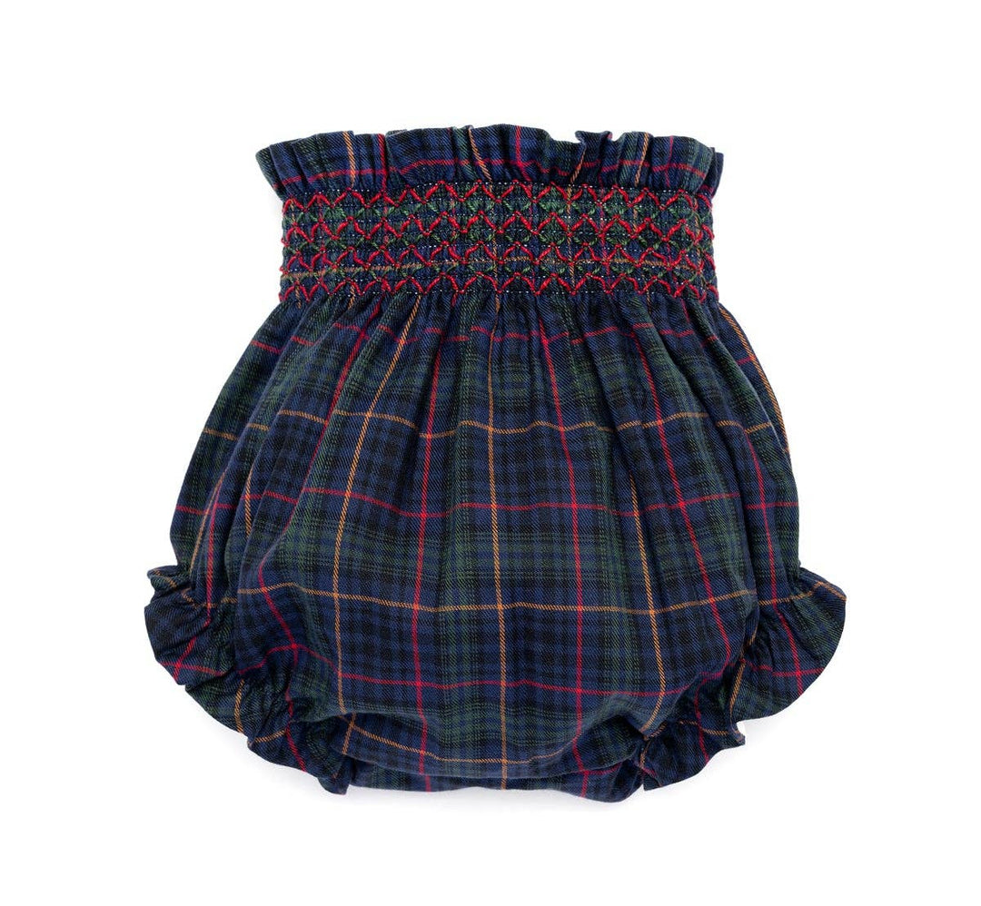 A pair of baby bloomers in a dark navy blue tartan plaid pattern with red, yellow, and green lines, featuring a smocked waistband.