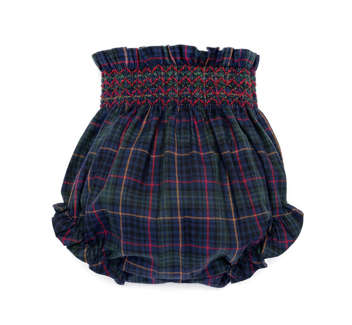 A pair of baby bloomers in a dark navy blue tartan plaid pattern with red, yellow, and green lines, featuring a smocked waistband.