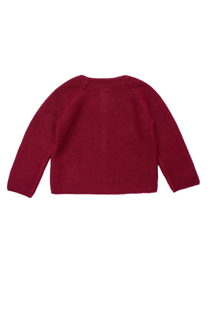Red knitted sweater on a white background