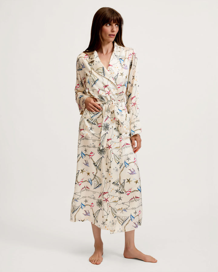 Women wearing a nautical print silk robe in front of white background