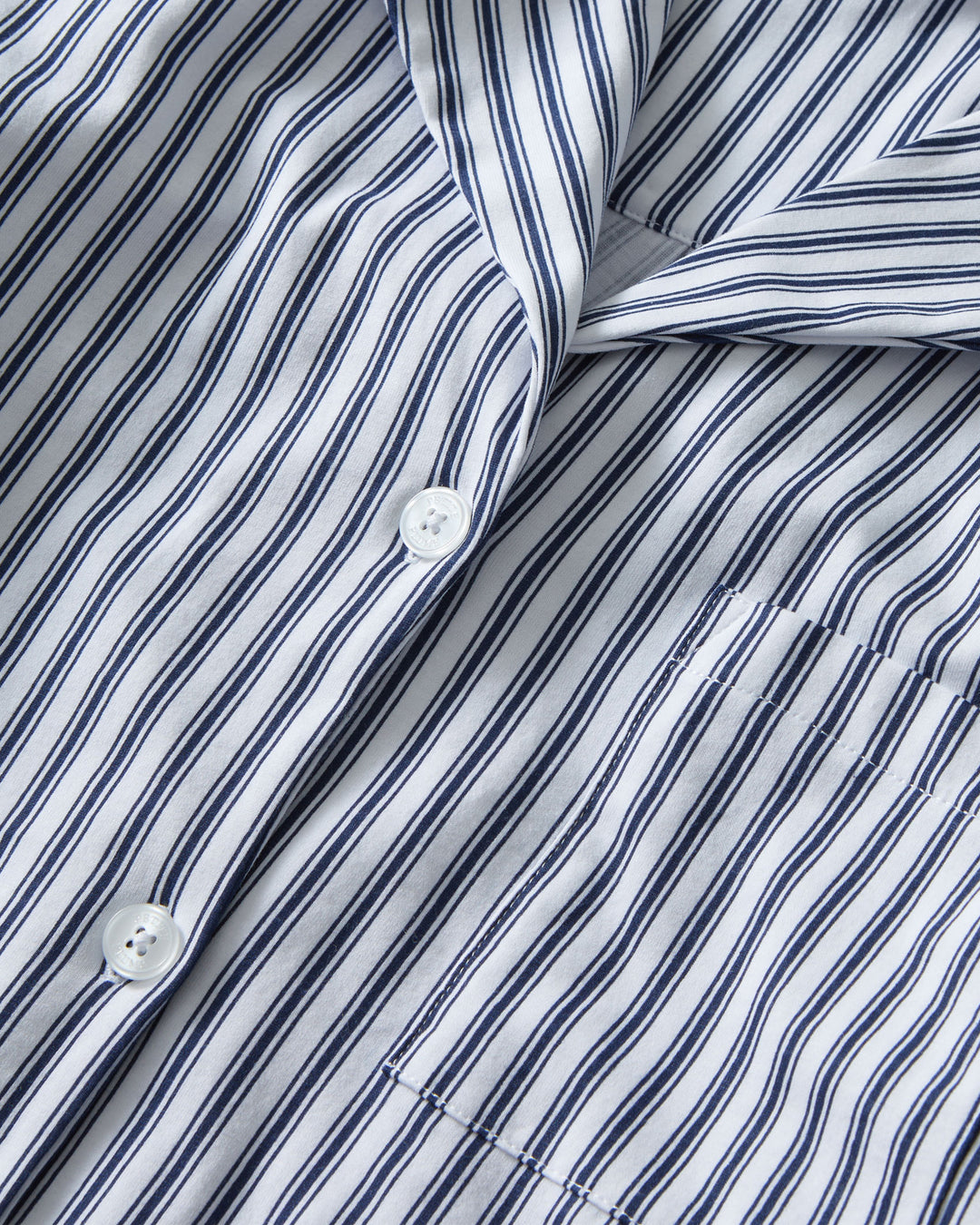 Striped shirt with a collar and buttons on a plain background
