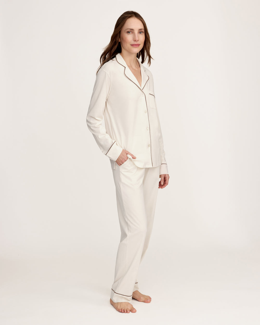 Woman wearing an ivory pima cotton pajama set