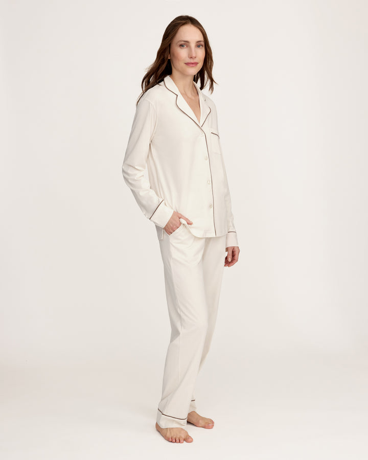 Woman wearing an ivory pima cotton pajama set