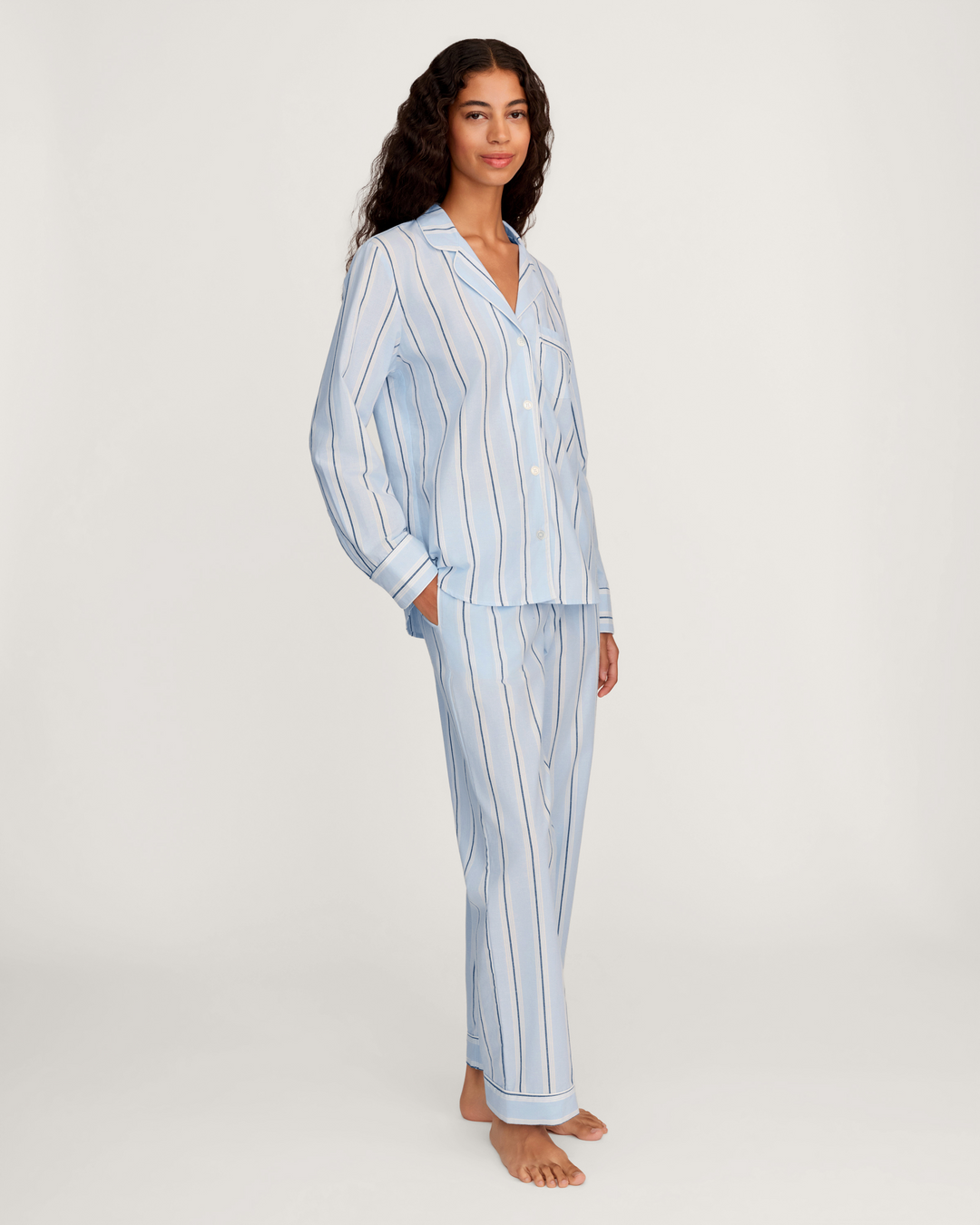 Women wearing light blue striped pajamas