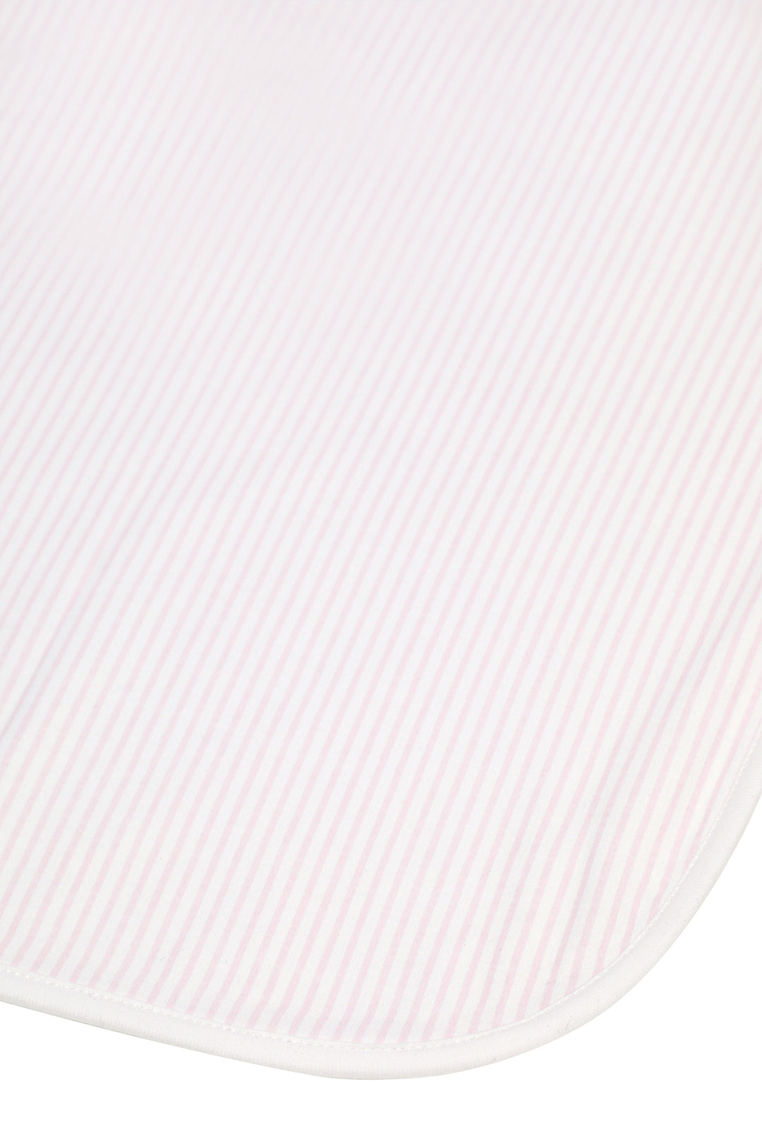 A close-up of a white ribbed fabric with a rounded corner and a thin white stitched edge, shown against a white background.