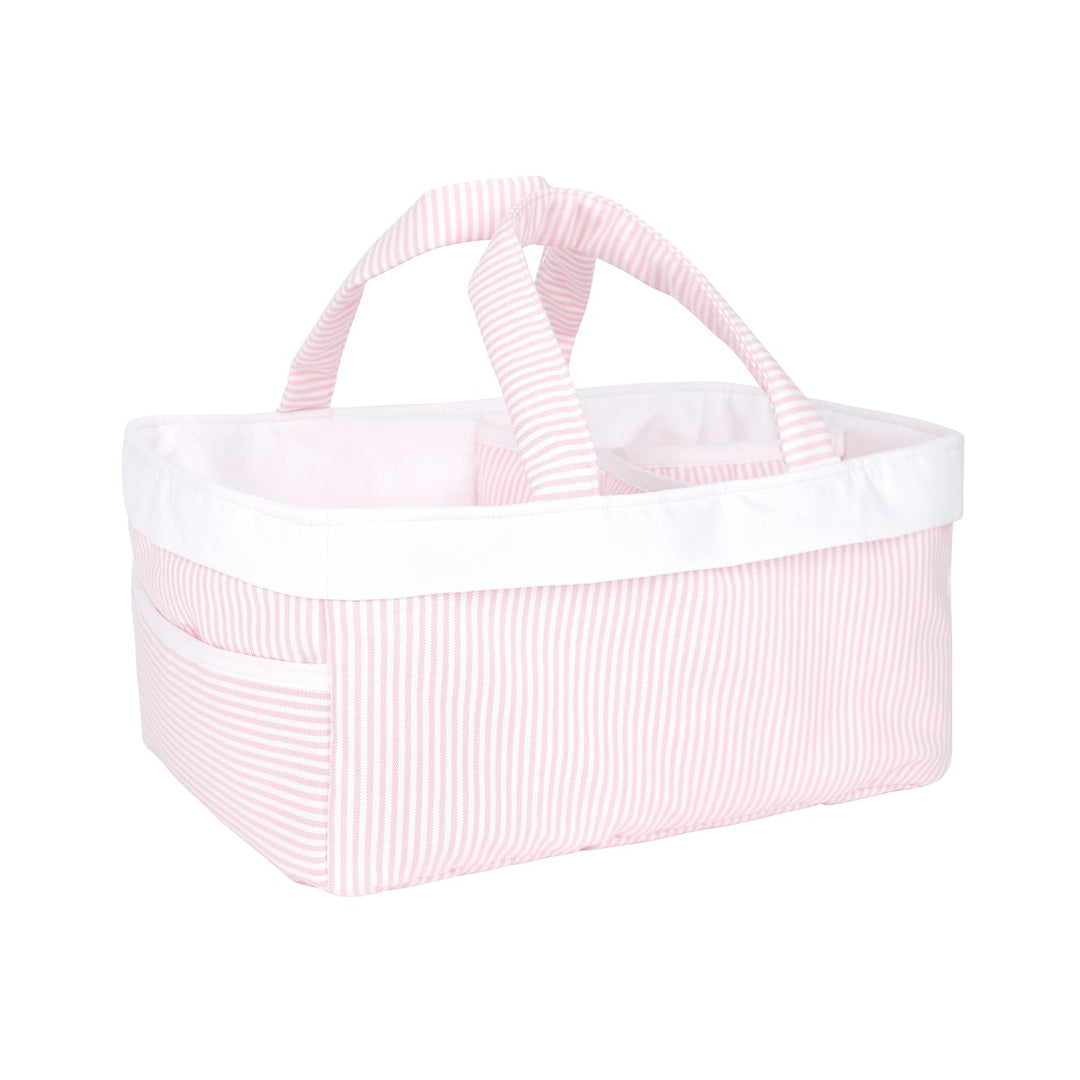 Pink woven basket with white trim on a white background