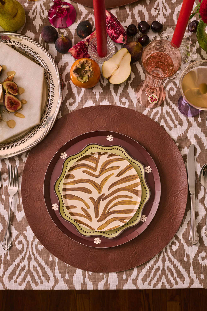 Mint Plume dessert paper plate on a brown charger, styled with autumn fruit and florals