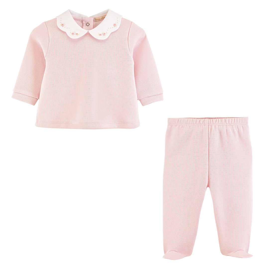 Pink children's outfit with a shirt and pants on a white background
