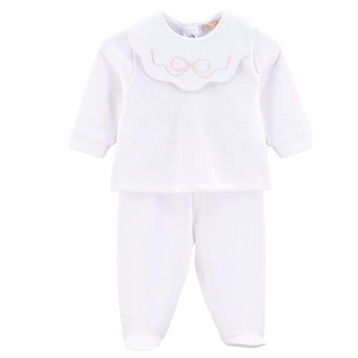 A white baby sleepwear set consisting of a long-sleeve top with a scalloped Peter Pan collar featuring a light pink embroidered bow, paired with matching white footed pants, shown on a plain white background.