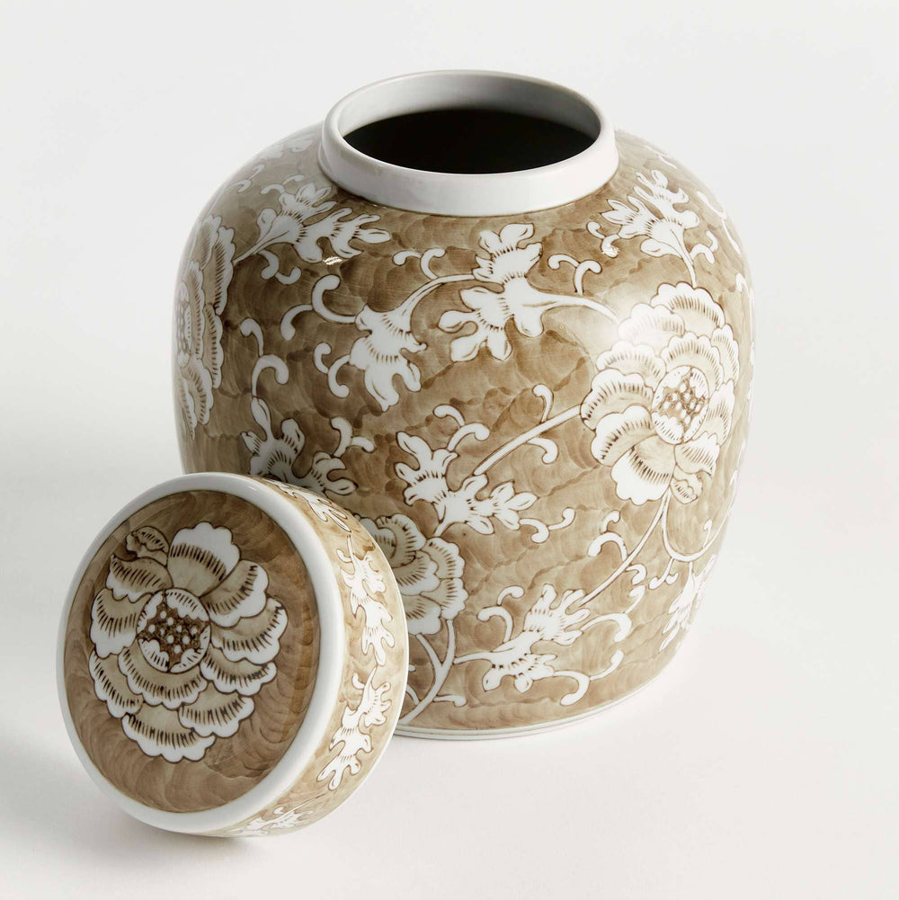 A ceramic ginger jar with a matching lid, featuring a textured beige and brown glaze with white floral patterns, photographed on a clean white background.