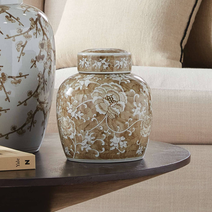 Decorative vase with floral patterns on a wooden surface