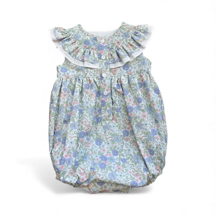 Floral baby romper with ruffled collar on a white background