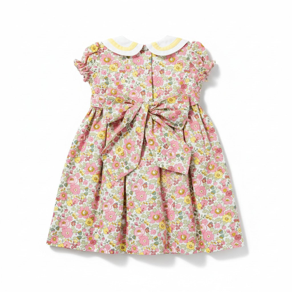 Floral dress with a bow on a white background