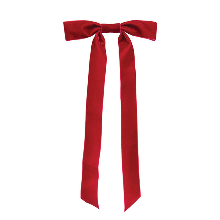 A bright red satin bow with two long tails, tied in the center and photographed against a plain white background.