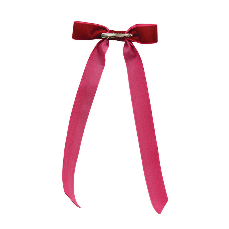 A bright red  ribbon tied into a bow with a small silver metal clasp, shown against a plain white background.