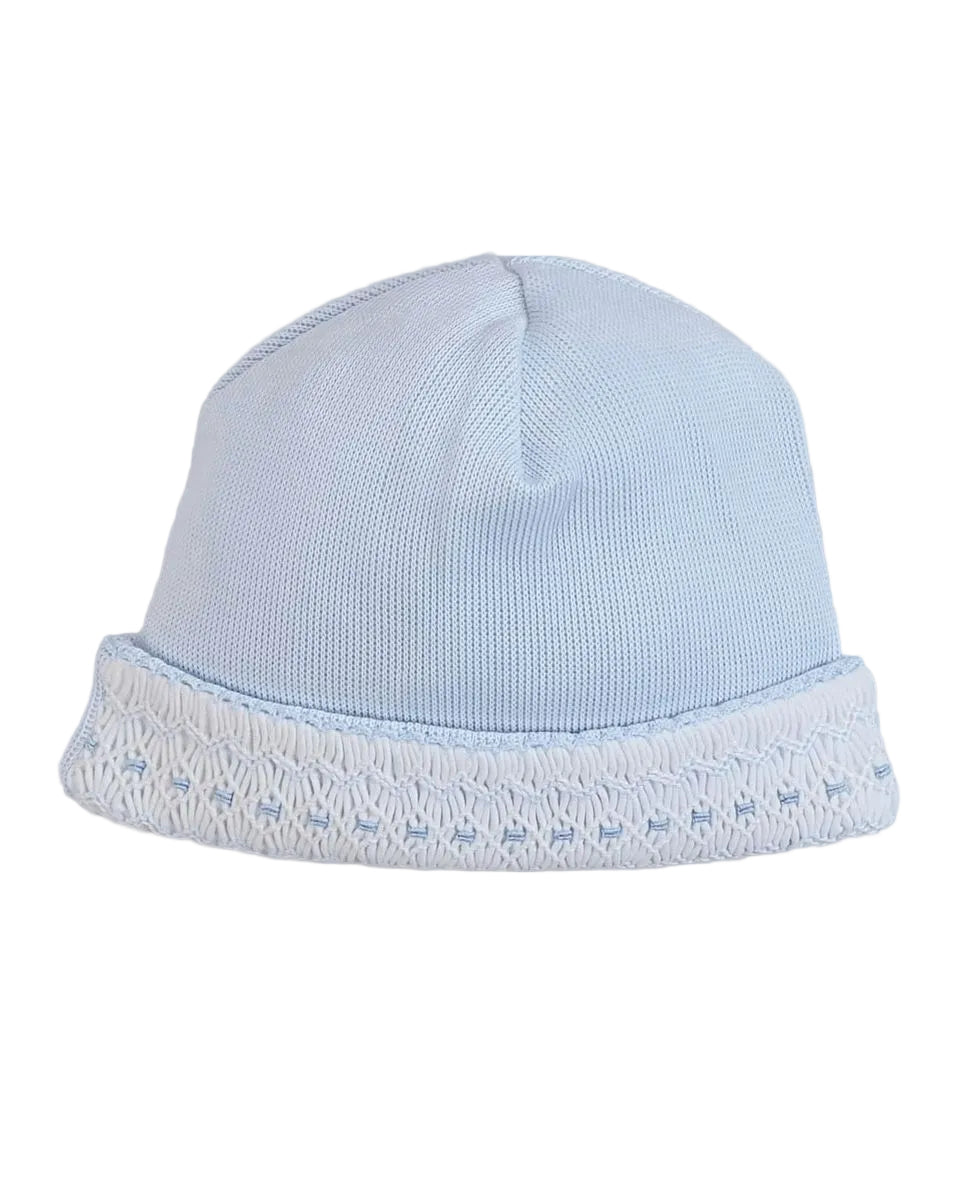 A light blue knit baby beanie hat with a folded cuff featuring a textured white patterned trim, shown against a solid light gray background.