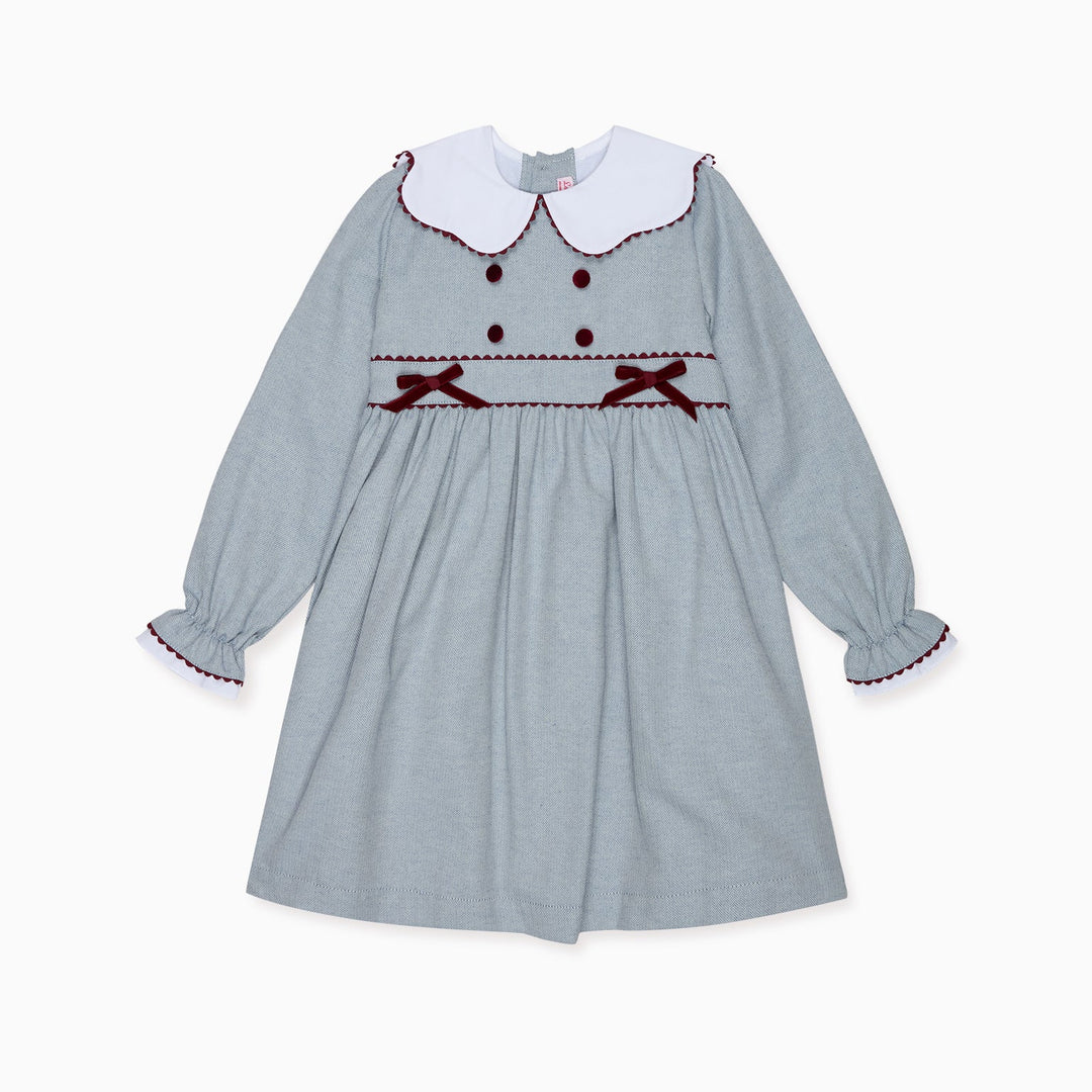 Children's dress with long sleeves and a white collar on a white background