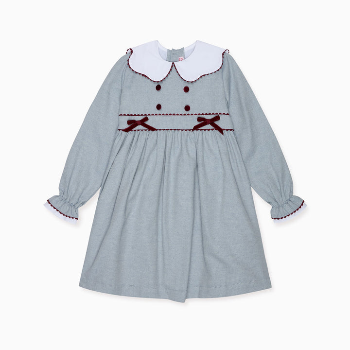 Children's dress with long sleeves and a white collar on a white background