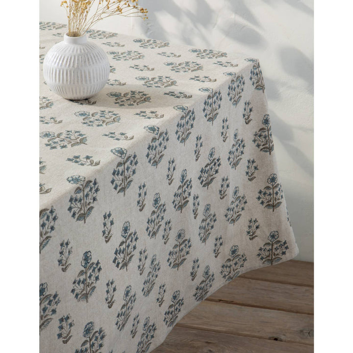 Tablecloth with floral pattern on a wooden table