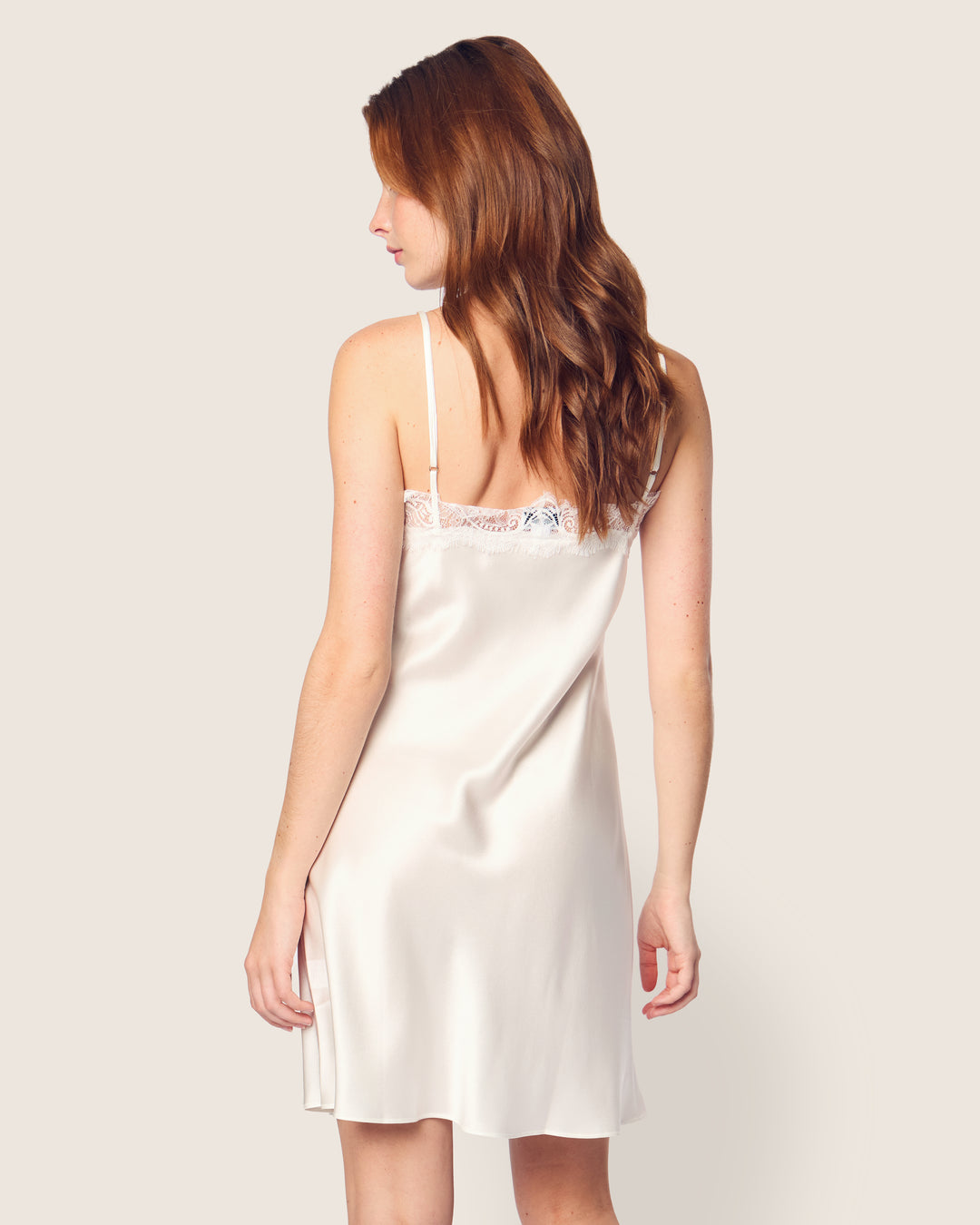 Tea length silk slip dress with spaghetti straps and delicate lace