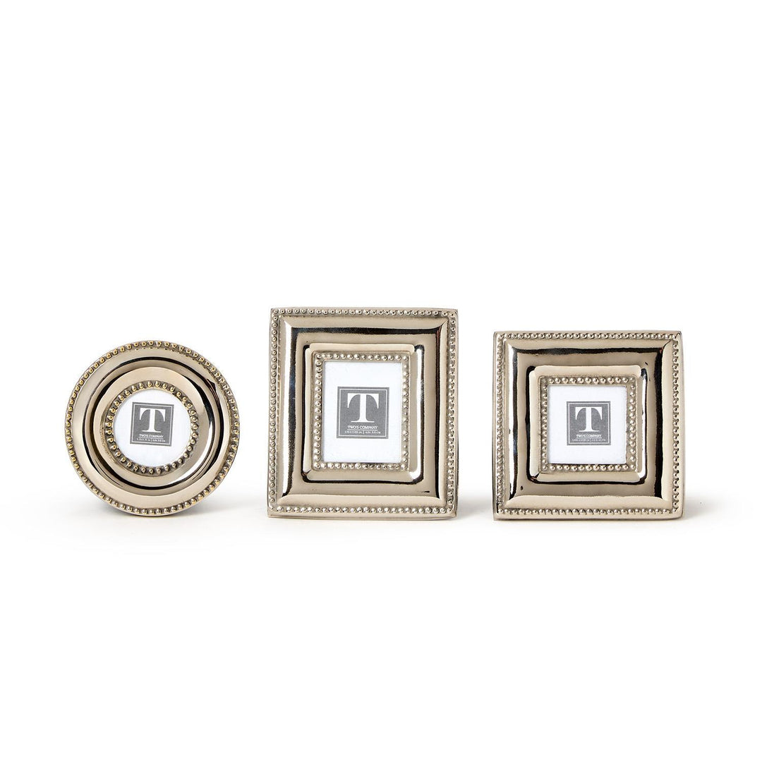 Three decorative picture frames of different sizes on a white background
