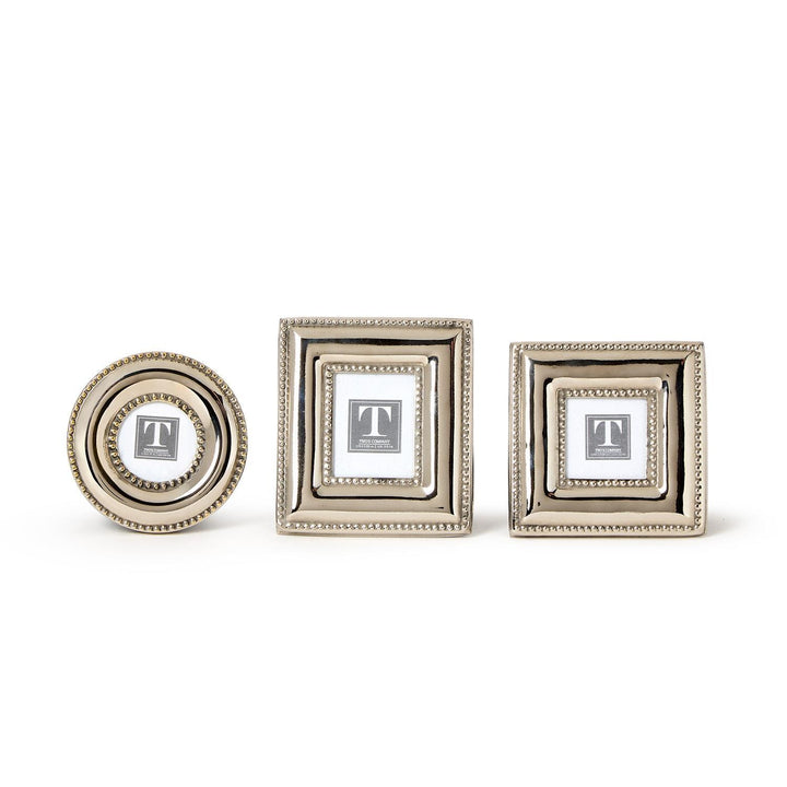 Three decorative picture frames of different sizes on a white background