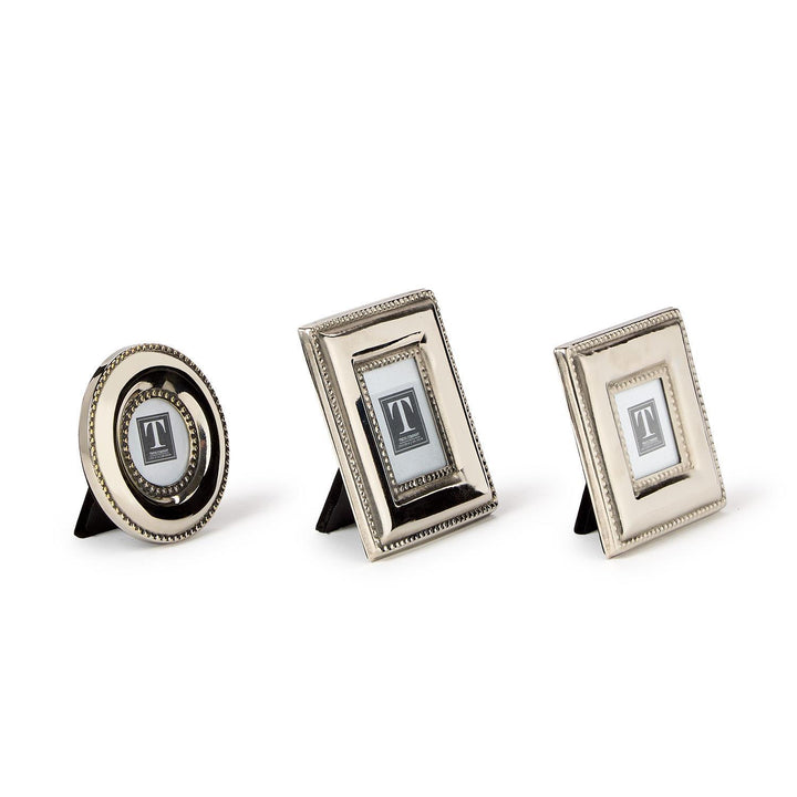 Three decorative picture frames with monogram on a white background