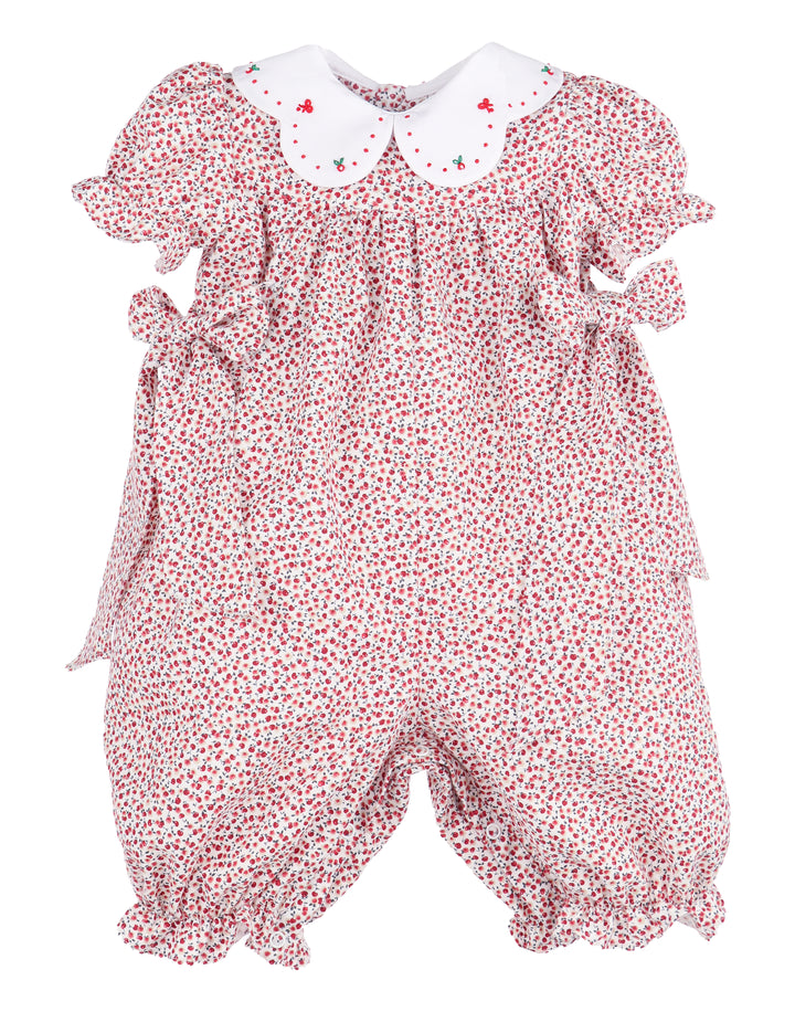 Baby romper with apple pattern on a white background