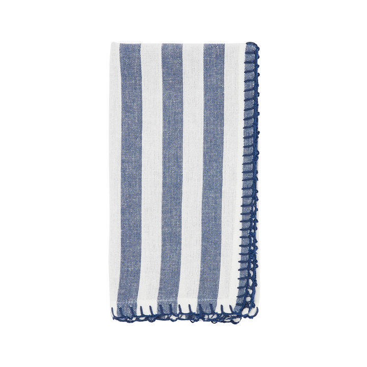 Striped blue and white towel with frayed edges on a white background